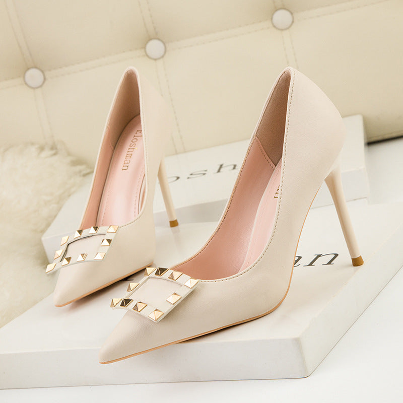 Pointed toe metal rivet stiletto heels