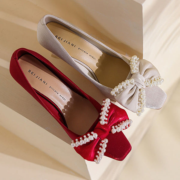 Low fronted bow tie solid pointed heels with pearls