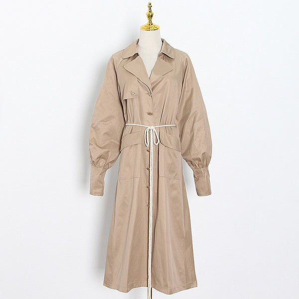 Brief solid single breasted belted trench coats