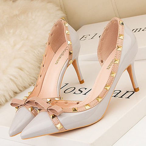 Rivet embellished side cut out pointed toe stiletto heels